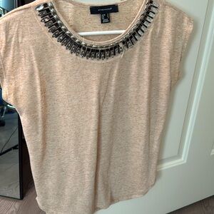 Beige/pink top with detailing at top. Good condition. Size small.